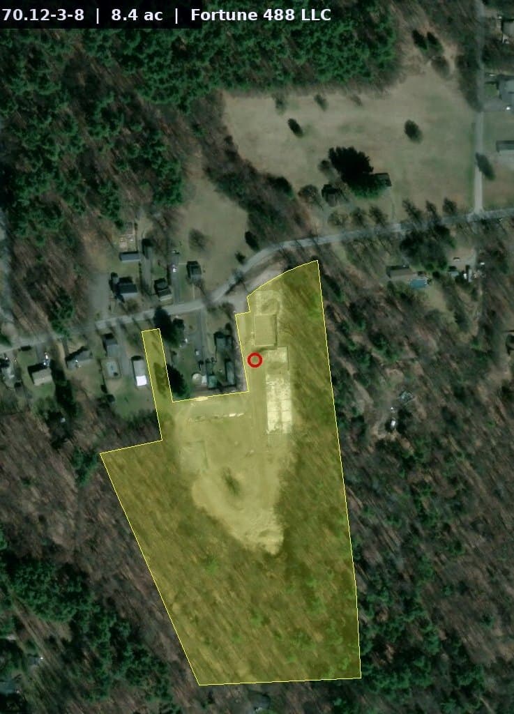 Magazine-portrait crop of the parcel-overlay aerial.